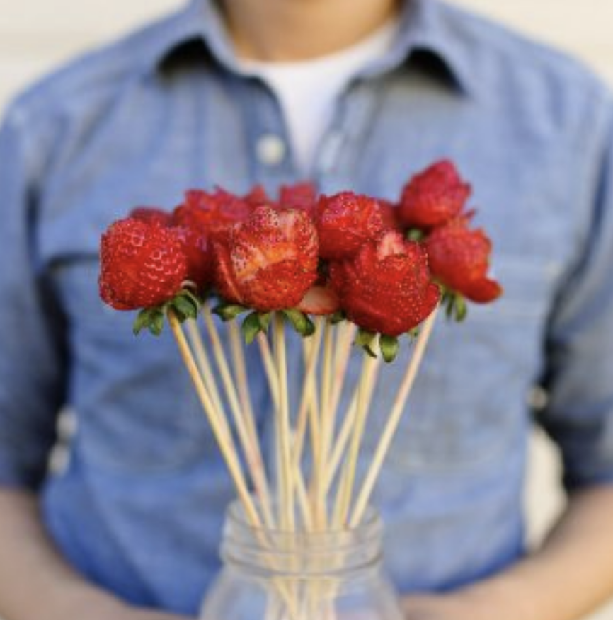 holding strawberry bouquet